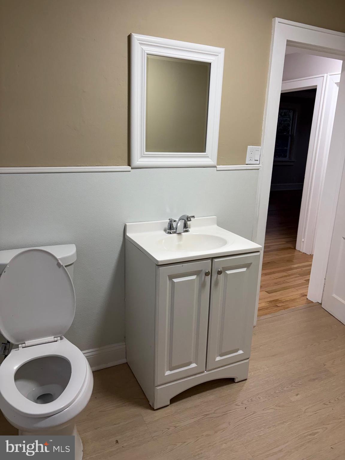 175 9th Street Salem, NJ 08079 - Photo 19 of 24 a bathroom with a sink a toilet and a mirror