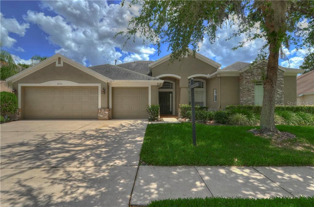 Home boasts wonderful curb appeal with lush green lawn!
