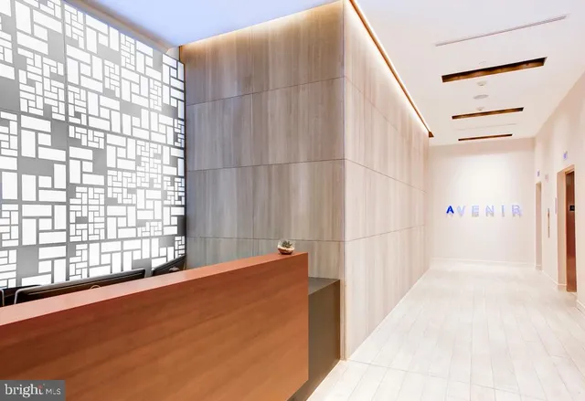 a kitchen with stainless steel appliances a stove a refrigerator and a fireplace