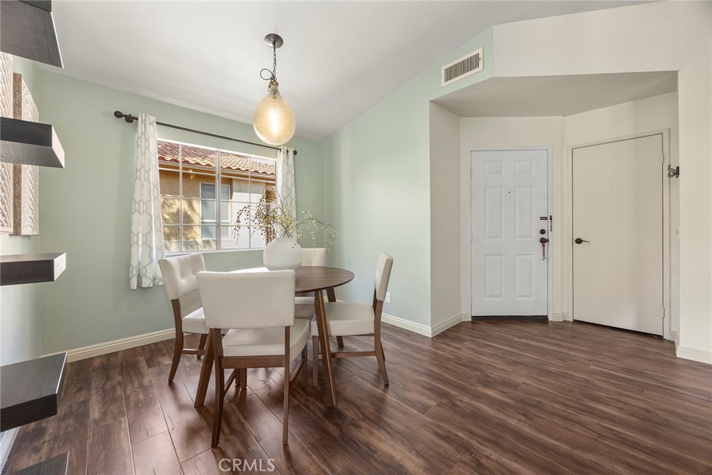 5370 Silver Canyon Road, Unit 7E Yorba Linda, CA 92887 - Photo 17 of 33 a view of a dining room with furniture window and wooden floor