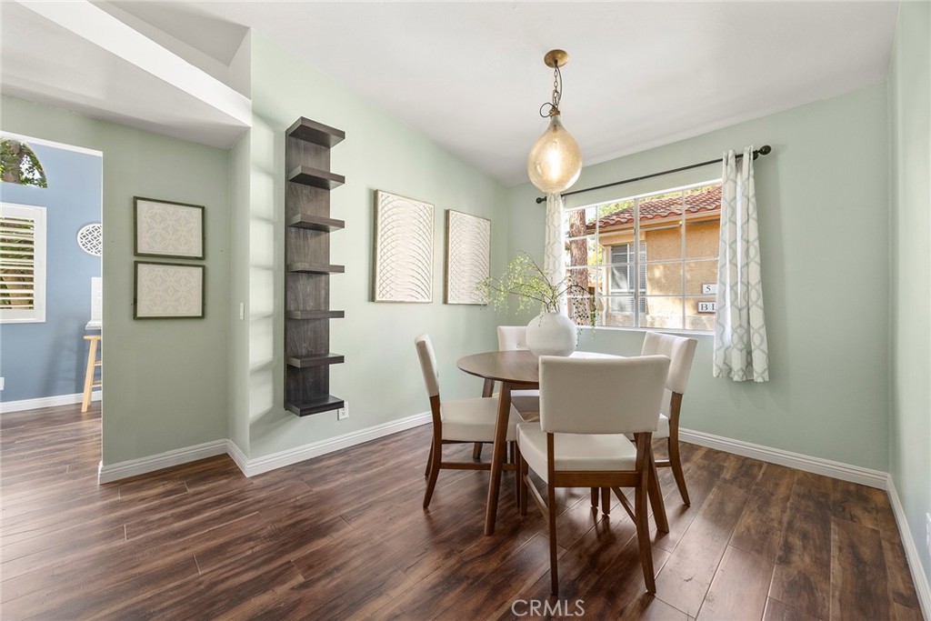 5370 Silver Canyon Road, Unit 7E Yorba Linda, CA 92887 - Photo 2 of 33 a view of a dining room with furniture window and wooden floor