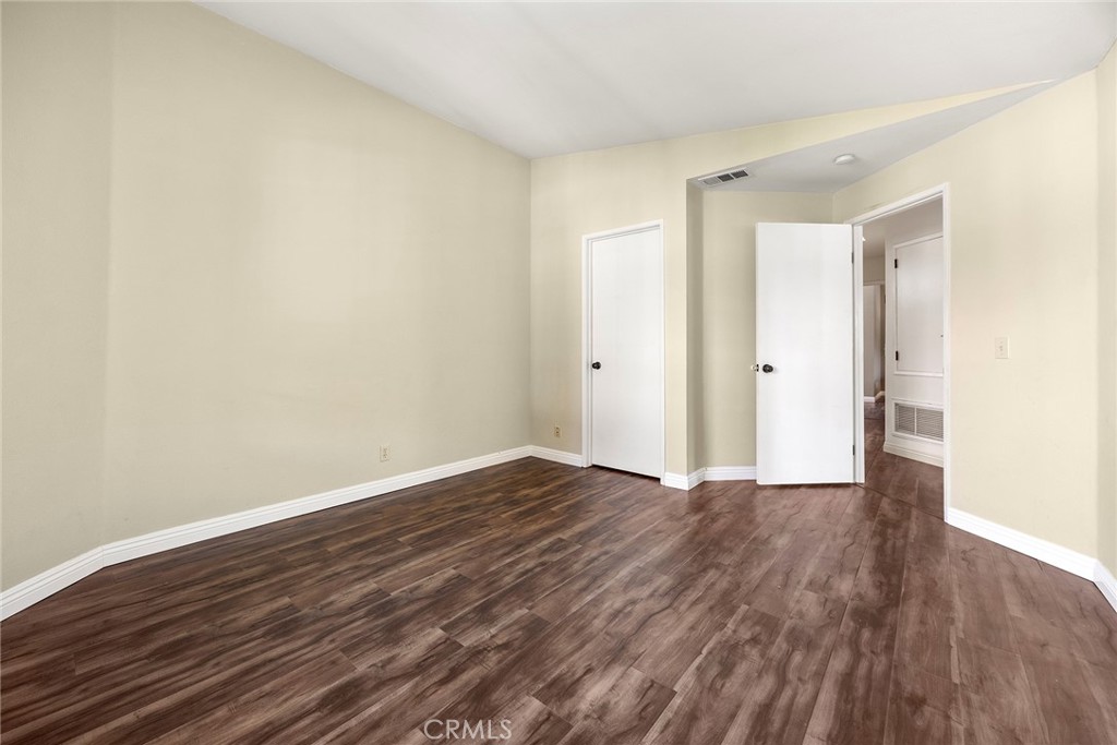 5370 Silver Canyon Road, Unit 7E Yorba Linda, CA 92887 - Photo 24 of 33 a view of an empty room with wooden floor