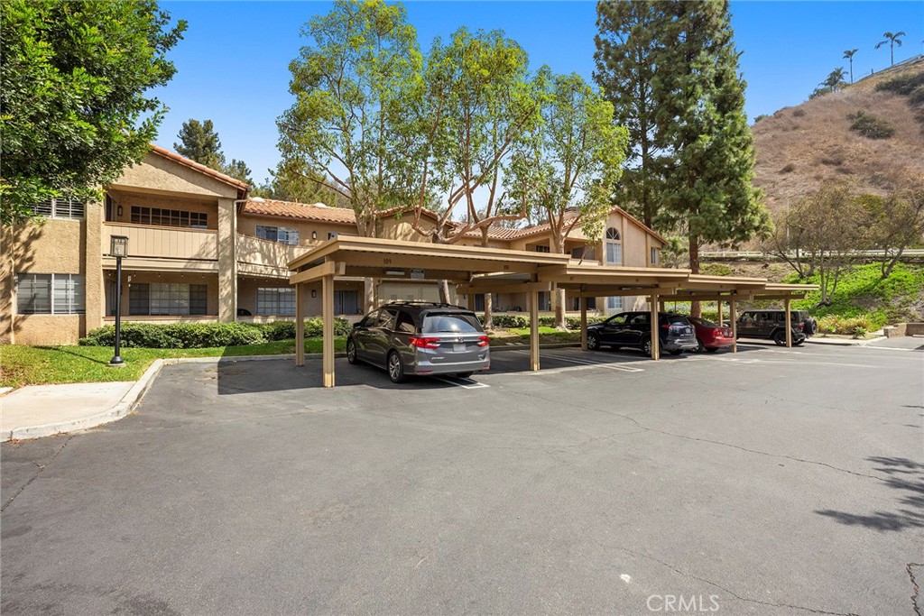 5370 Silver Canyon Road, Unit 7E Yorba Linda, CA 92887 - Photo 27 of 33 a car parked in front of building