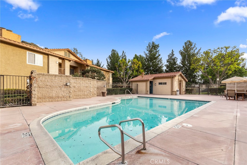 5370 Silver Canyon Road, Unit 7E Yorba Linda, CA 92887 - Photo 32 of 33 a view of a house with pool and sitting area