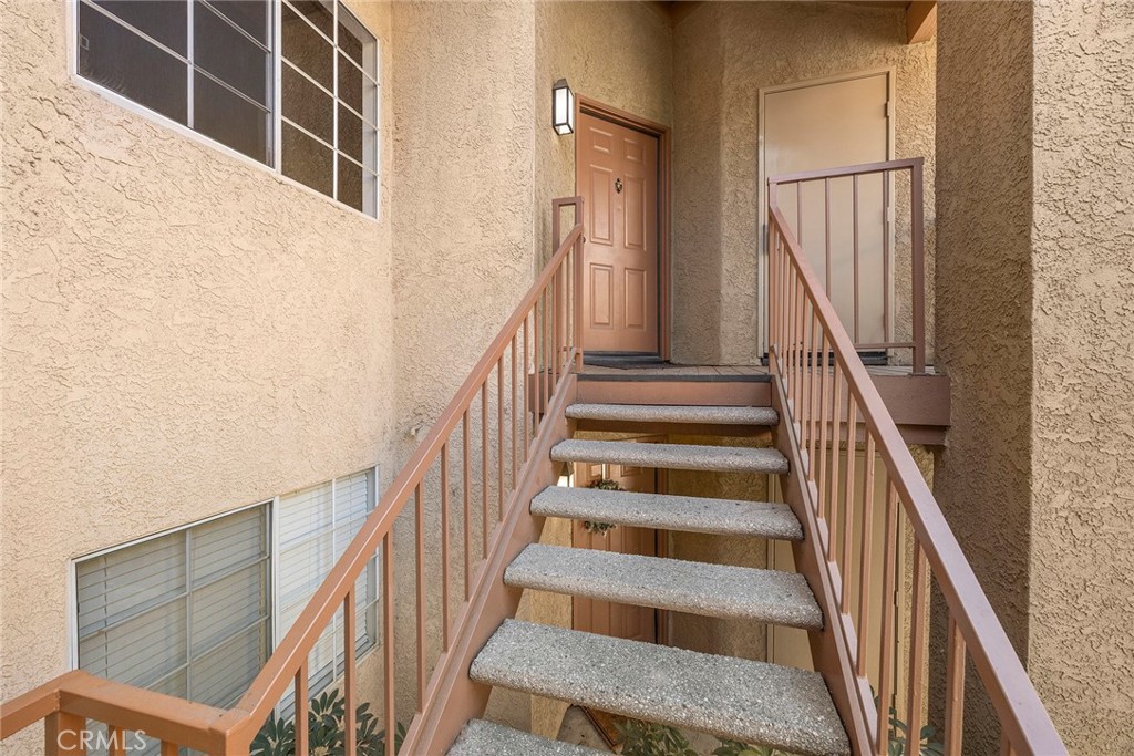 5370 Silver Canyon Road, Unit 7E Yorba Linda, CA 92887 - Photo 5 of 33 a view of staircase with wooden floor and white walls