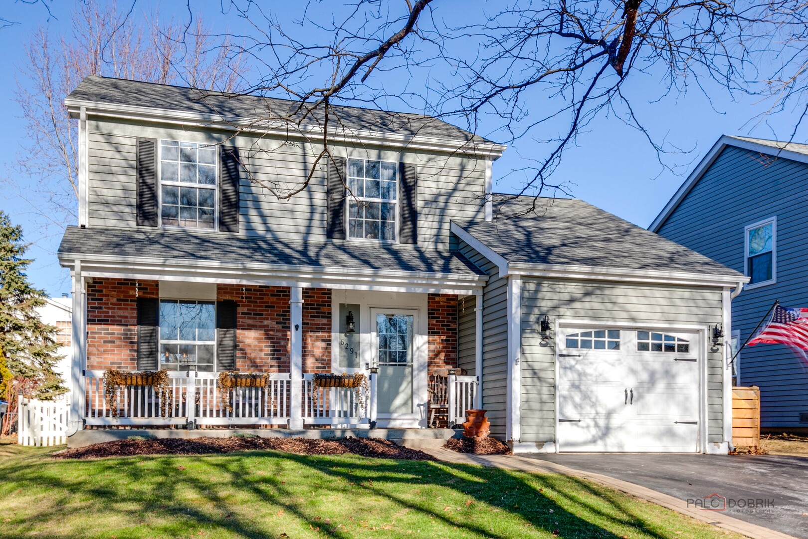 front view of a house with a yard