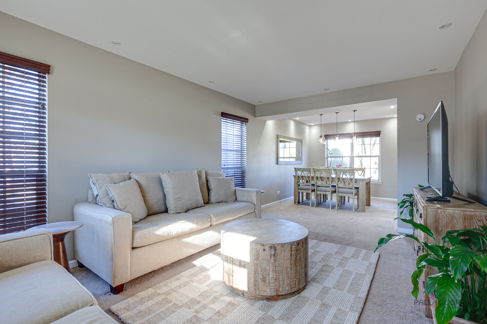 6291 Eagle Ridge Drive Gurnee, IL 60031 - Photo 12 of 40 a living room with furniture and a flat screen tv