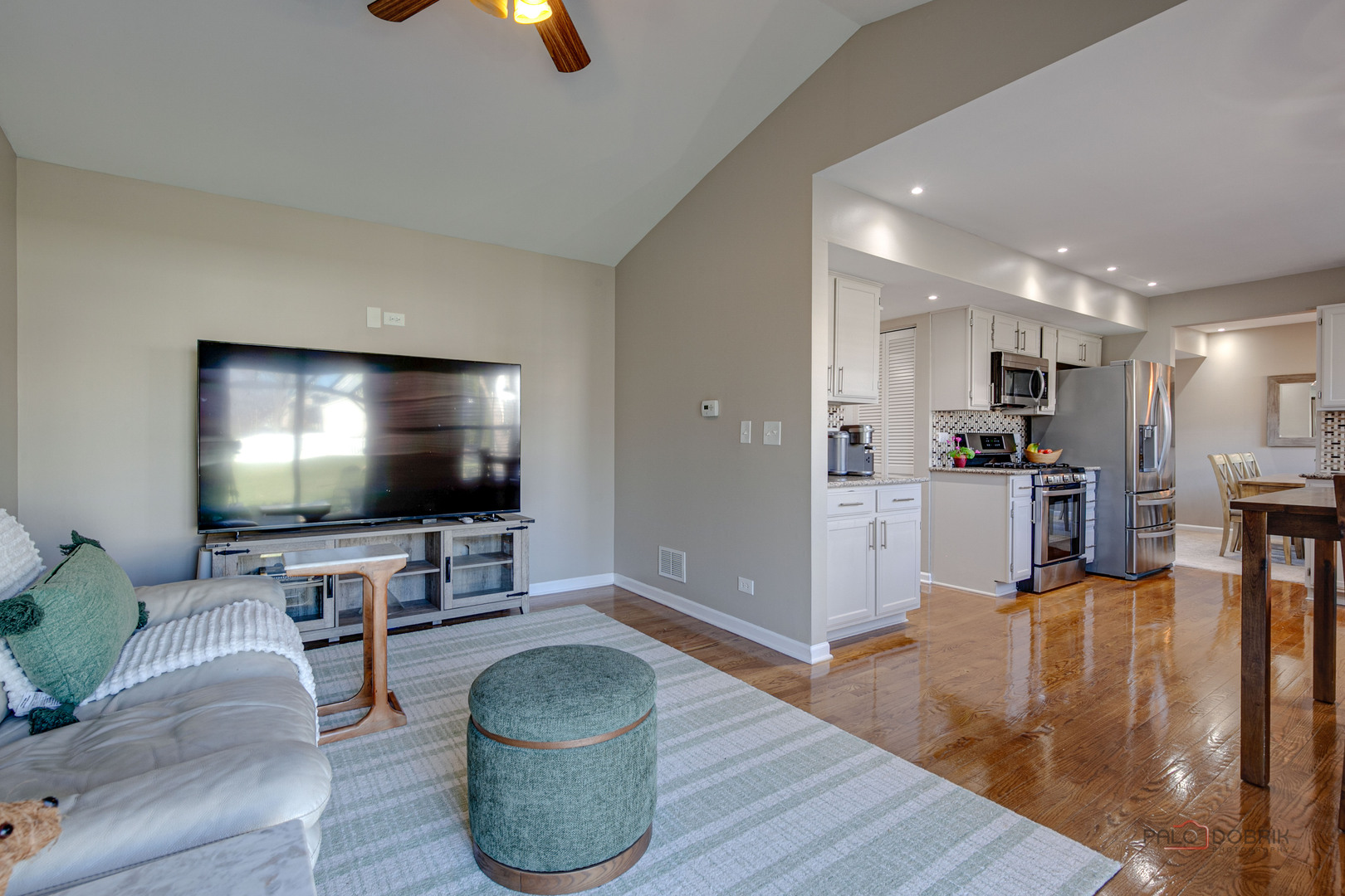 6291 Eagle Ridge Drive Gurnee, IL 60031 - Photo 19 of 40 a living room with furniture and a flat screen tv