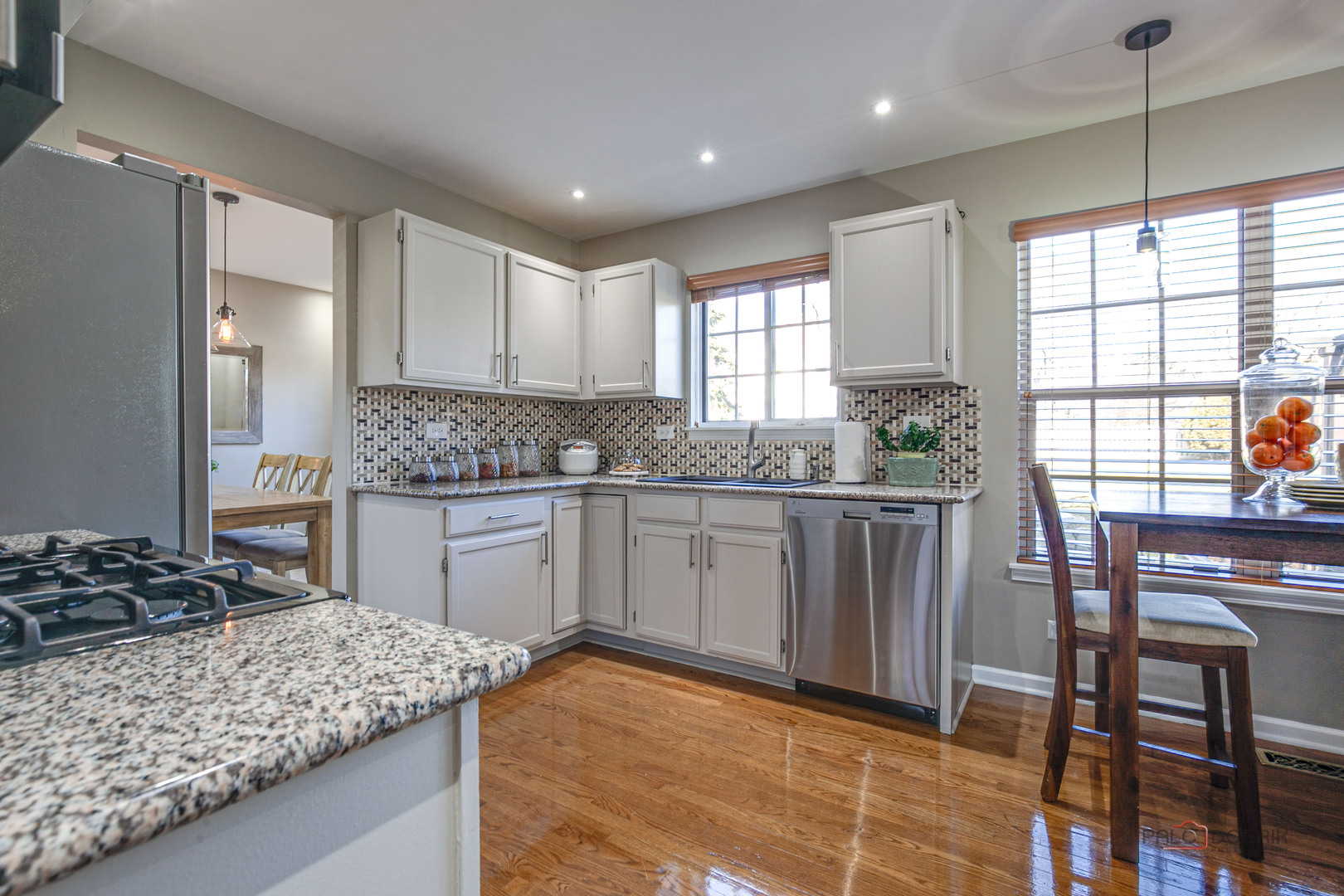 6291 Eagle Ridge Drive Gurnee, IL 60031 - Photo 22 of 40 a kitchen with stainless steel appliances granite countertop sink stove and refrigerator