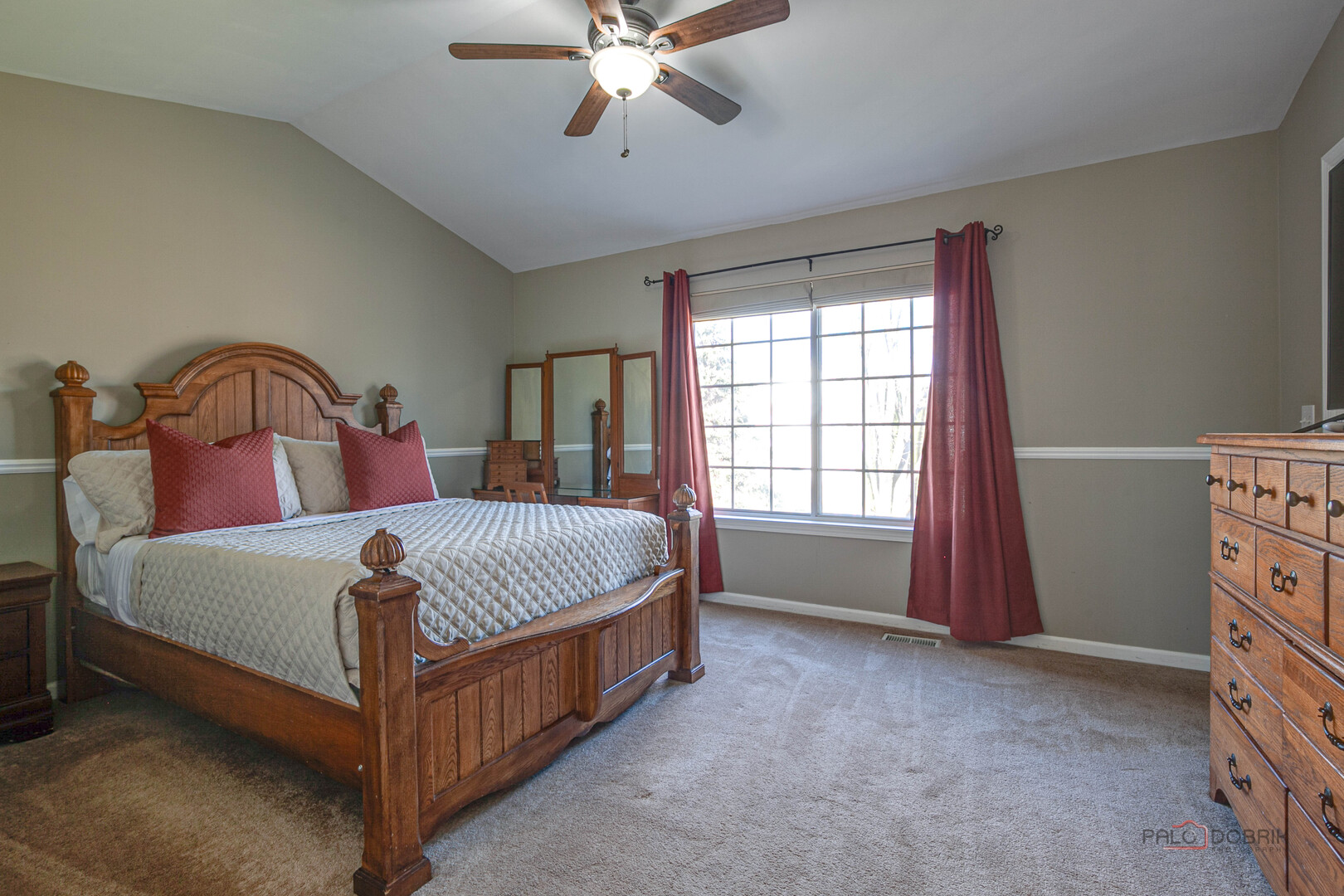 6291 Eagle Ridge Drive Gurnee, IL 60031 - Photo 26 of 40 a bedroom with a bed a window and a chandelier