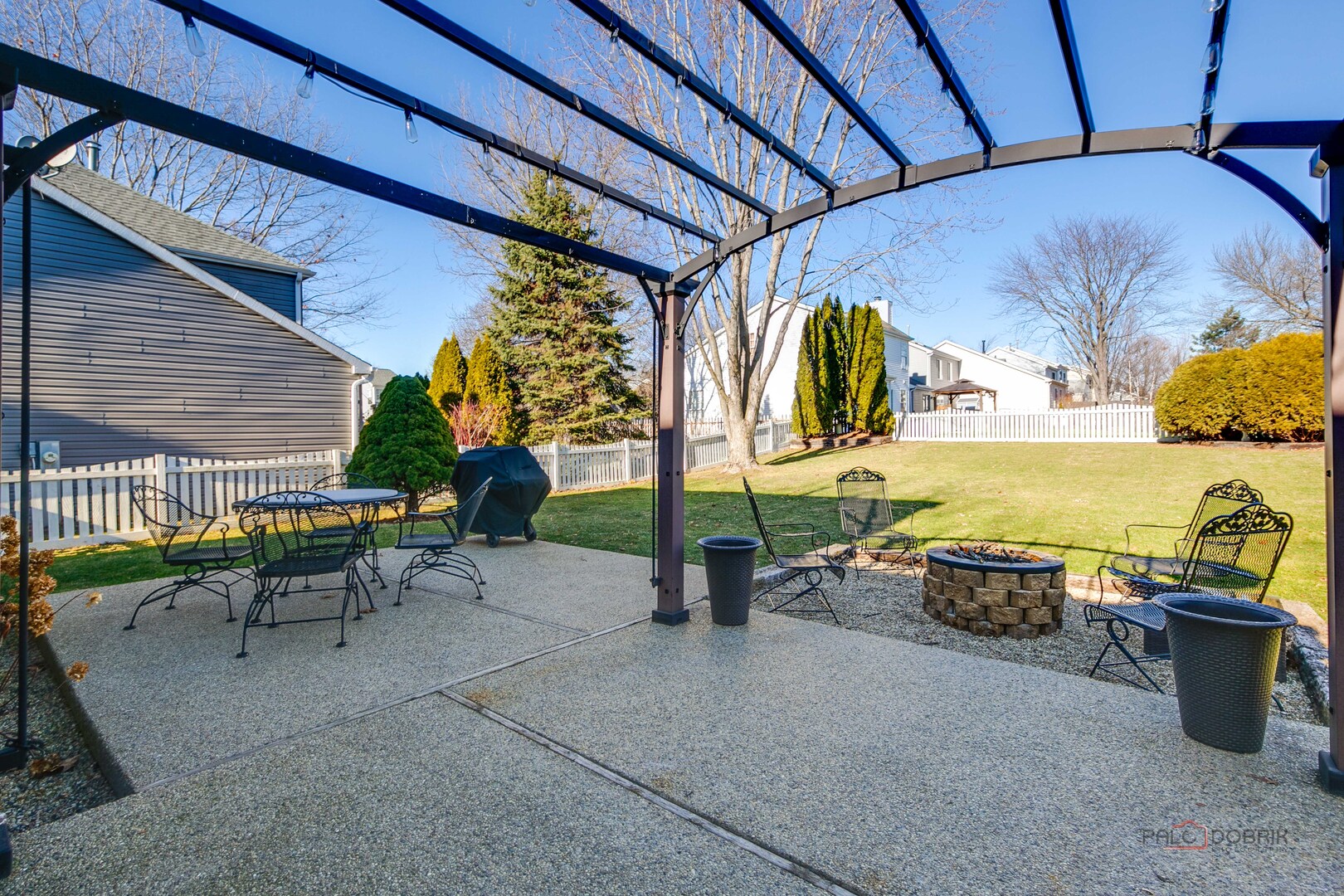 6291 Eagle Ridge Drive Gurnee, IL 60031 - Photo 31 of 40 a view of a patio with a table and chairs under an umbrella