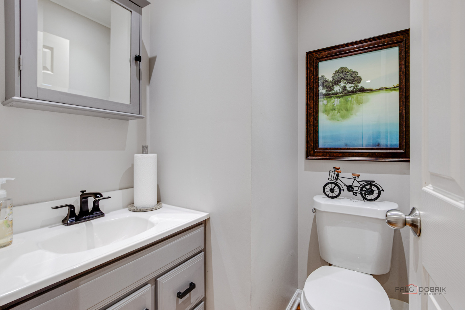 6291 Eagle Ridge Drive Gurnee, IL 60031 - Photo 10 of 40 a bathroom with a toilet sink and mirror