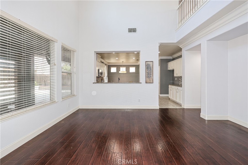 1367 Esplanade Drive Merced, CA 95348 - Photo 11 of 51 a view of a big room with wooden floor and windows