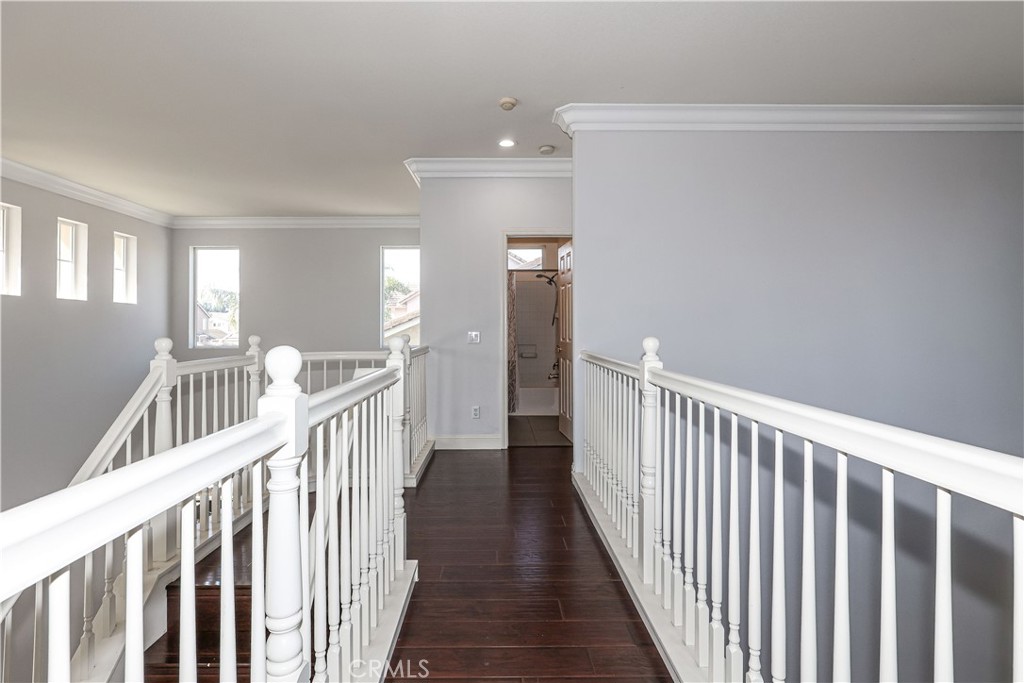 1367 Esplanade Drive Merced, CA 95348 - Photo 12 of 51 a view of a hallway with wooden floor and windows