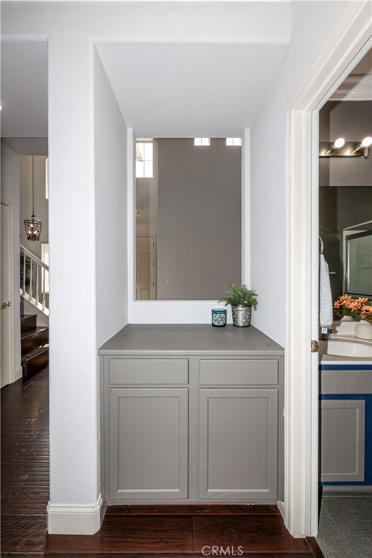 1367 Esplanade Drive Merced, CA 95348 - Photo 18 of 51 a hallway with sink and mirror