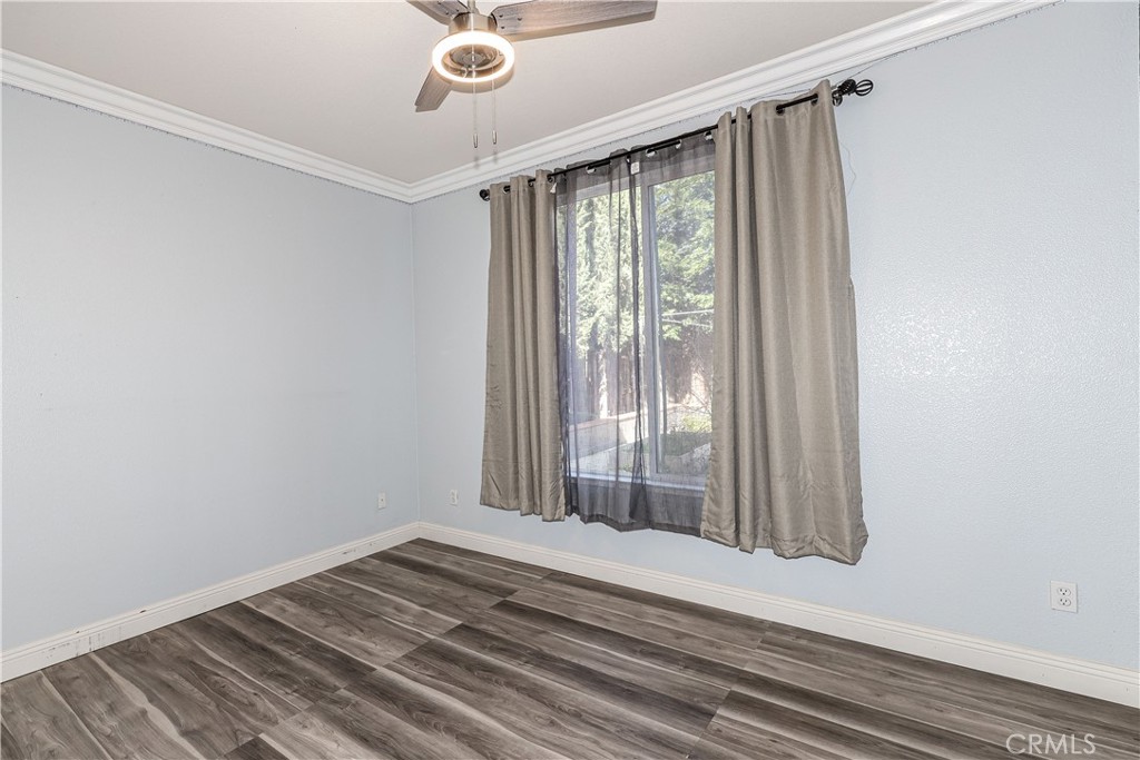 1367 Esplanade Drive Merced, CA 95348 - Photo 22 of 51 a view of a room with wooden floor and windows