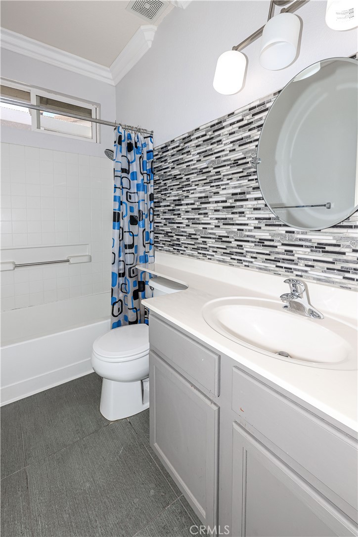 1367 Esplanade Drive Merced, CA 95348 - Photo 23 of 51 a bathroom with a sink a toilet and shower