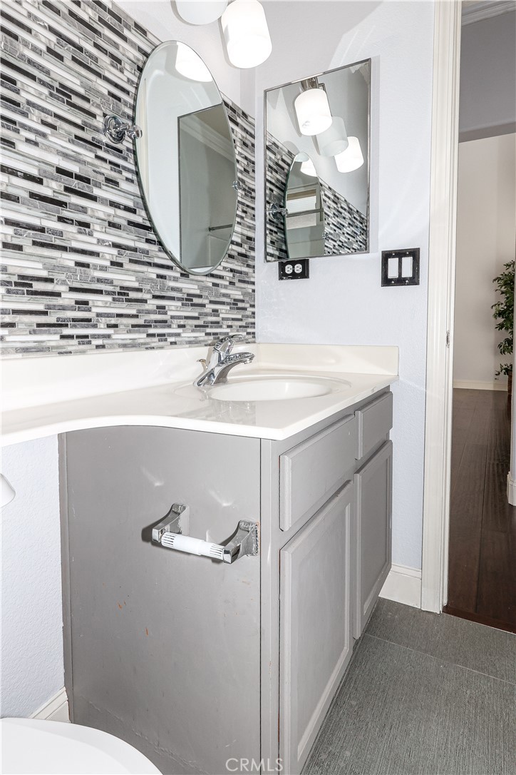 1367 Esplanade Drive Merced, CA 95348 - Photo 24 of 51 a bathroom with a sink and a mirror