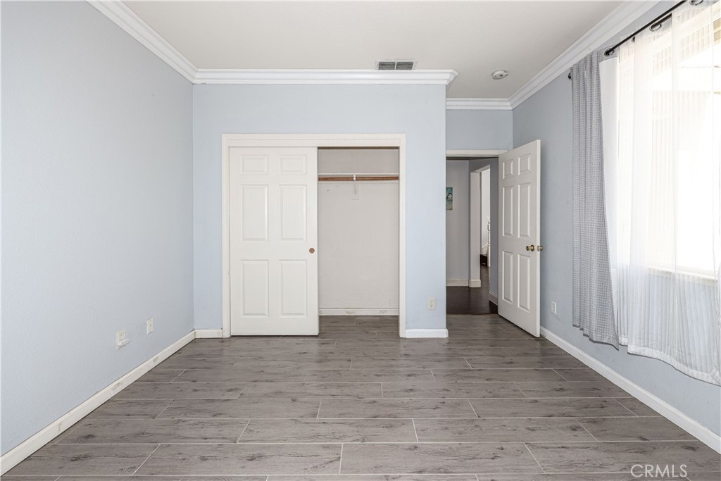 1367 Esplanade Drive Merced, CA 95348 - Photo 27 of 51 an empty room with closet and windows