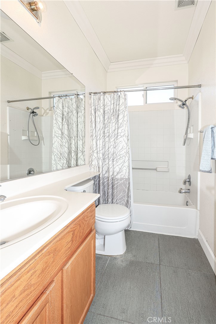 1367 Esplanade Drive Merced, CA 95348 - Photo 29 of 51 a bathroom with a sink a toilet and a bathtub