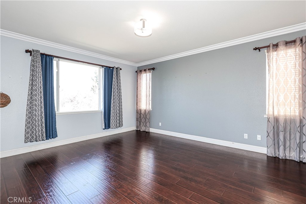1367 Esplanade Drive Merced, CA 95348 - Photo 31 of 51 a view of an empty room with wooden floor and a window