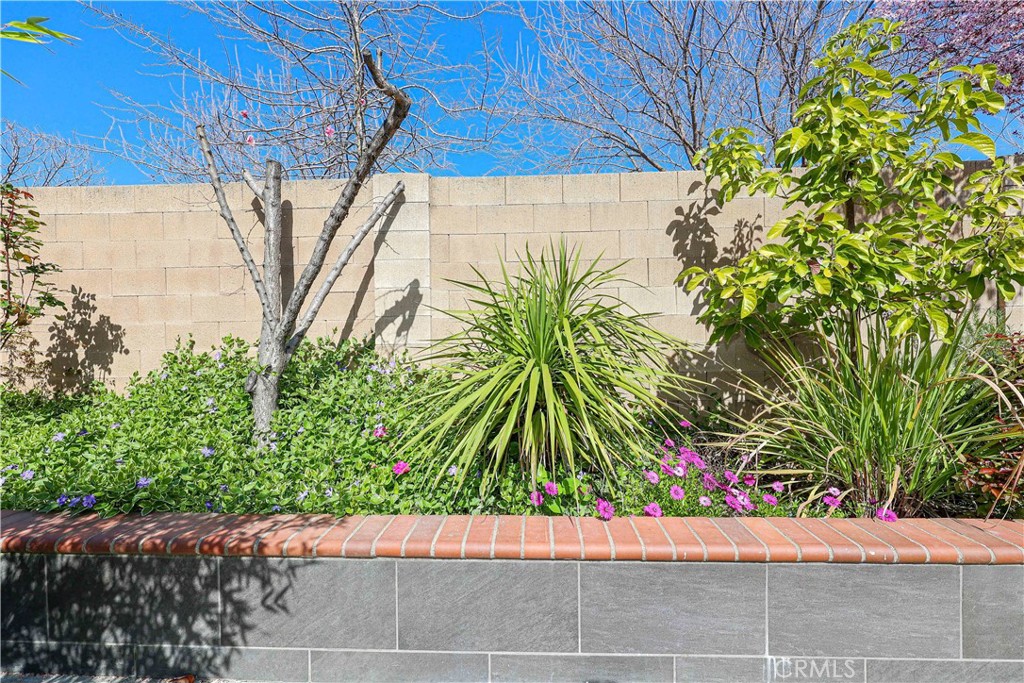 1367 Esplanade Drive Merced, CA 95348 - Photo 51 of 51 a small garden area with flowers and wooden fence