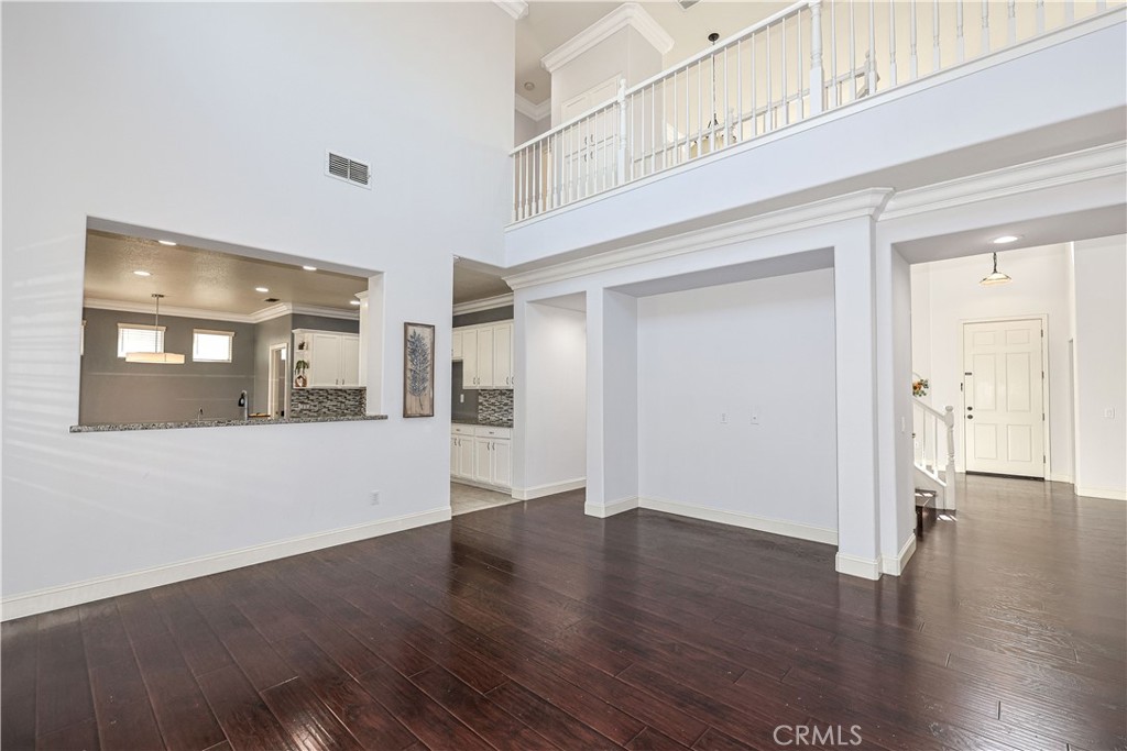 1367 Esplanade Drive Merced, CA 95348 - Photo 10 of 51 a view of an empty room with wooden floor
