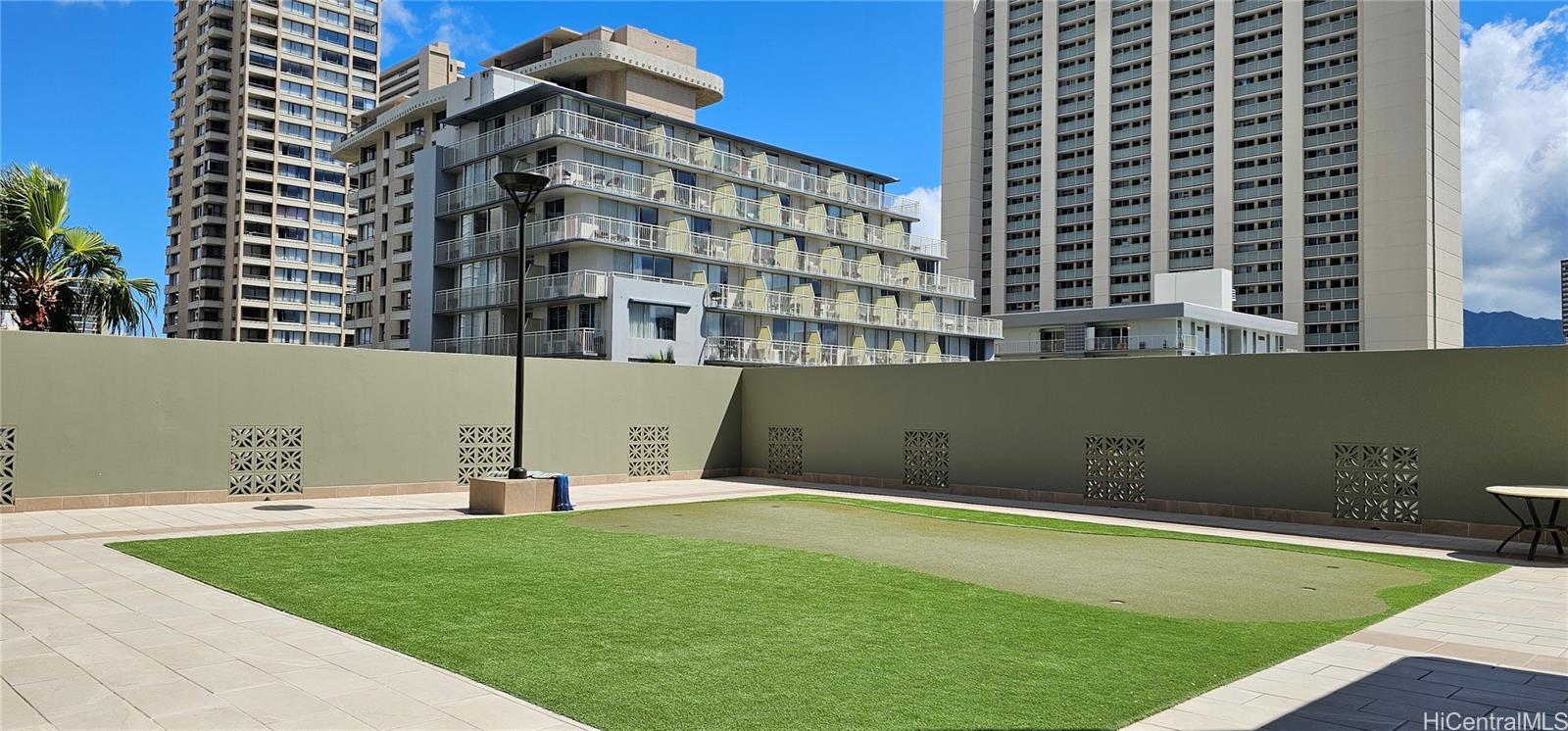 2240 Kūhiō Avenue, Unit 905 Honolulu, HI 96815 - Photo 13 of 18 a view of a swimming pool with a backyard