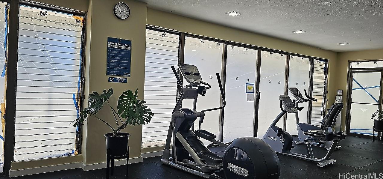 2240 Kūhiō Avenue, Unit 905 Honolulu, HI 96815 - Photo 15 of 18 a view of a room with gym equipment