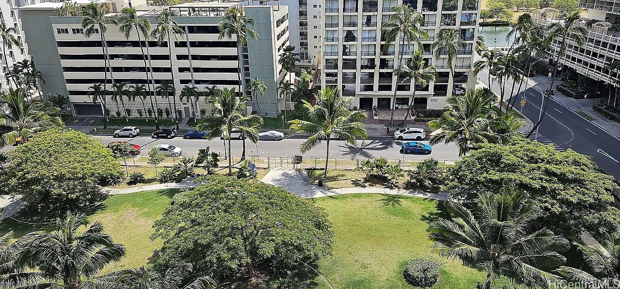 2240 Kūhiō Avenue, Unit 905 Honolulu, HI 96815 - Photo 18 of 18 a view of swimming pool with outdoor seating and plants