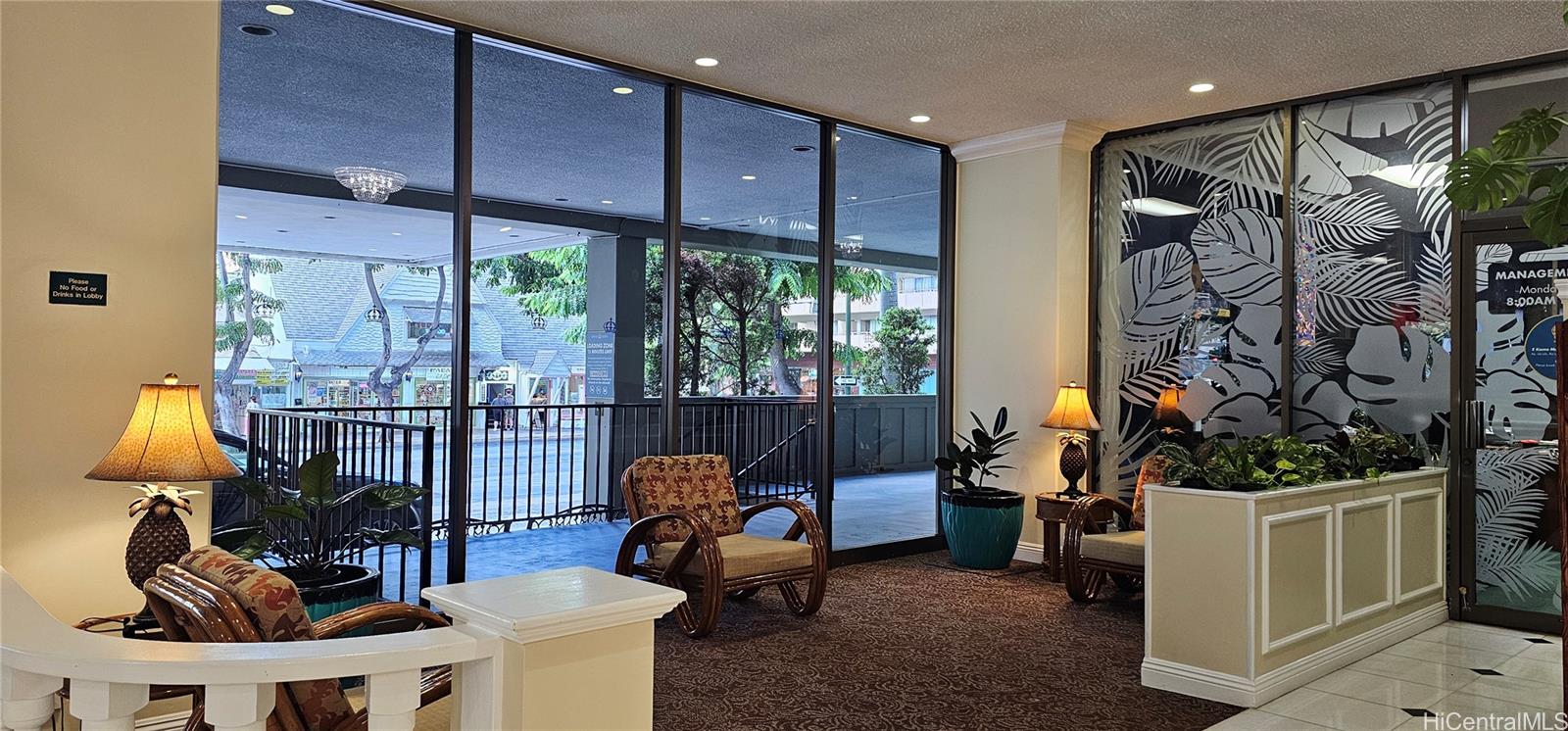 2240 Kūhiō Avenue, Unit 905 Honolulu, HI 96815 - Photo 9 of 18 a living room with furniture and a window