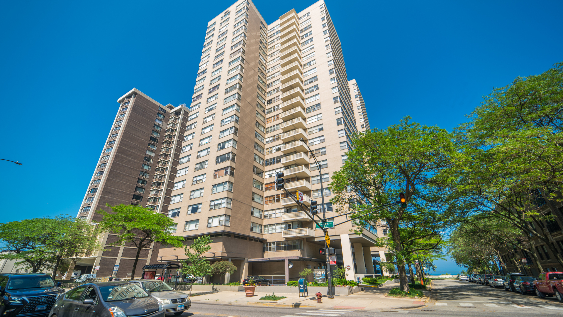 6301 North Sheridan Road, Unit 3P Chicago, IL 60660 - Photo 1 of 17 a view of a tall building next to a road
