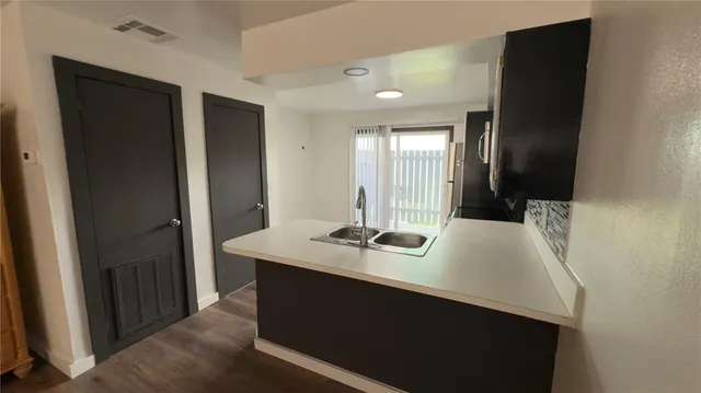 a room with a sink and a mirror