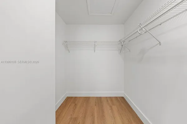 a bathroom with a double vanity sink mirror and shower