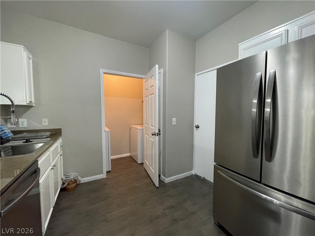 10001 Peace Way, Unit 1327 Las Vegas, NV 89147 - Photo 9 of 21 A well-appointed kitchen features a stainless steel refrigerator and ample counter space.