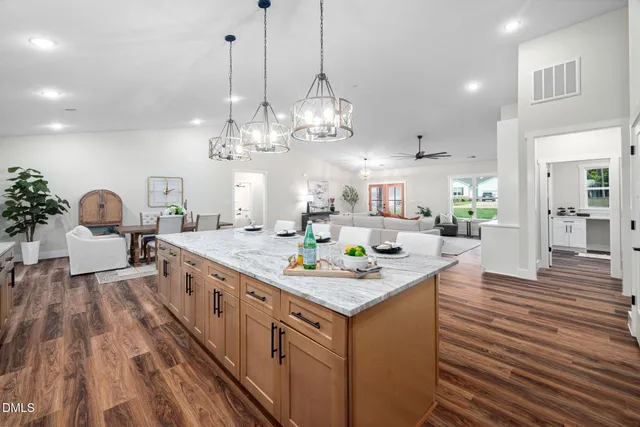 a very nice looking dining room with a table and chairs