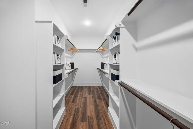 a bathroom with a granite countertop sink mirror and shower