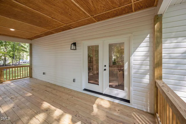 a view of deck with wooden floor and roof with wooden floor