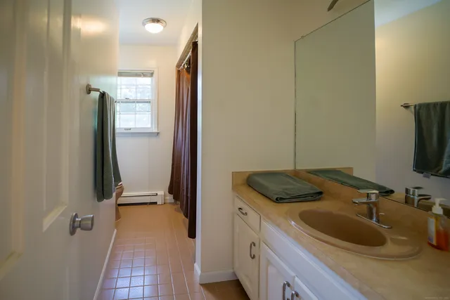 a bathroom with a sink and mirror