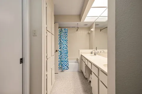 a view of storage and utility room with racks on the wall
