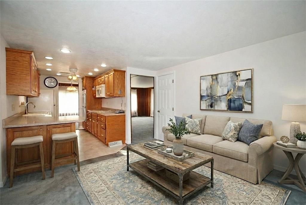 478 Cecil-Henderson Road Cecil, PA 15321 - Photo 11 of 28 a living room with furniture and kitchen view