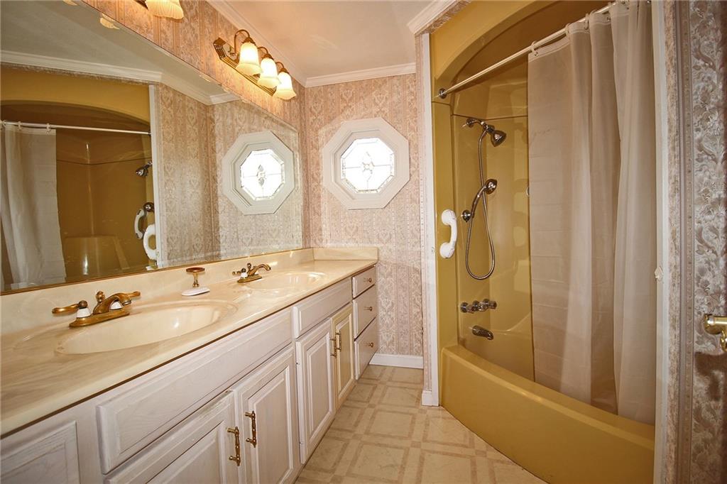 478 Cecil-Henderson Road Cecil, PA 15321 - Photo 15 of 28 a spacious bathroom with a double vanity sink mirror and bathtub
