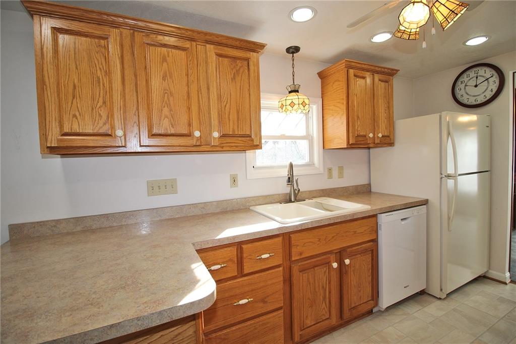 478 Cecil-Henderson Road Cecil, PA 15321 - Photo 7 of 28 a kitchen with a refrigerator and a sink