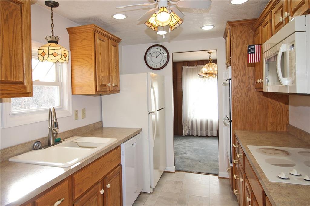 478 Cecil-Henderson Road Cecil, PA 15321 - Photo 8 of 28 a bathroom with a granite countertop sink a large mirror and a shower