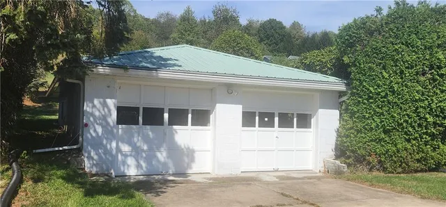 a house with trees in the background
