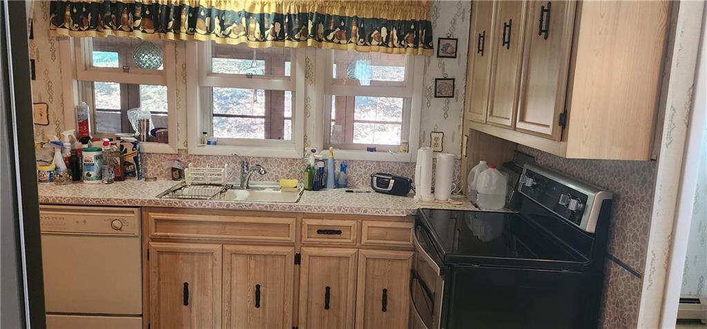 110 Lammert Road Indiana, PA 15701 - Photo 5 of 24 a kitchen with a sink a refrigerator and cabinets