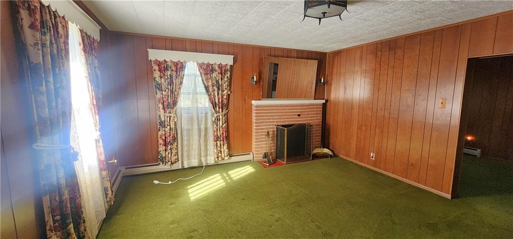 110 Lammert Road Indiana, PA 15701 - Photo 9 of 24 a view of an empty room with a fireplace and a window