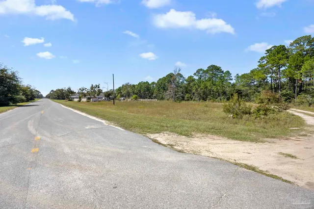 a sign on the wall next to a yard