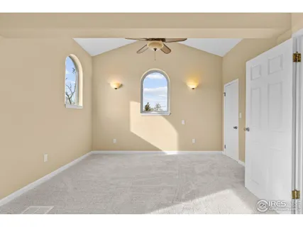 a view of a big room with closet and mirror