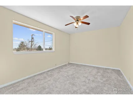 a view of a living room with a painting on the wall
